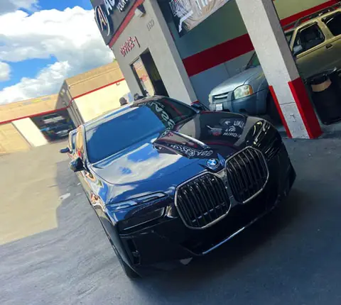 A black BMW X7 in the A1 Auto Glass bay in El Cajon for glass and window work