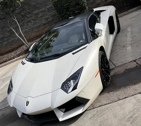 A white Lamborghini Aventador at A1 Auto Glass