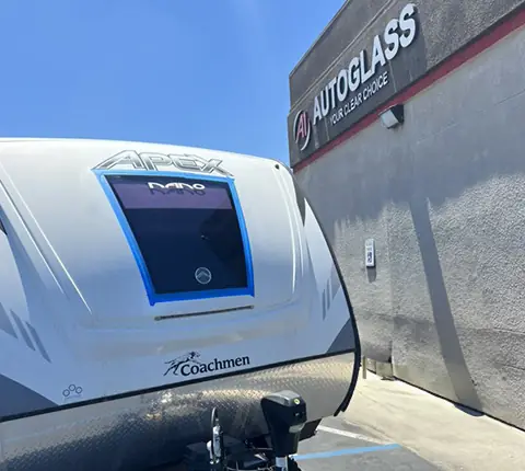 A travel trailer parked at the A1 Auto Glass storefront in El Cajon for a window tint job