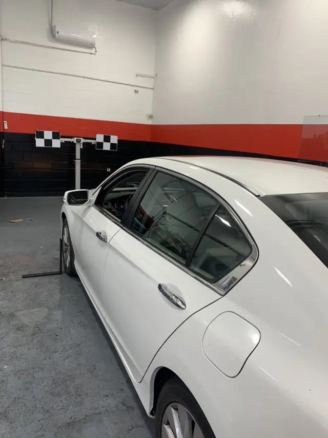 ADAS calibration target rig set up in front of a vehicle inside the A1 Auto Glass bay